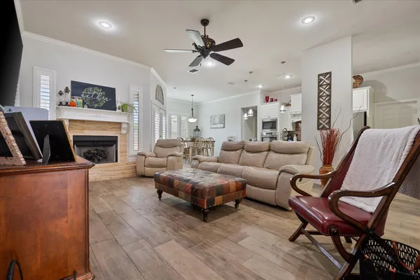 a living room with furniture a fireplace