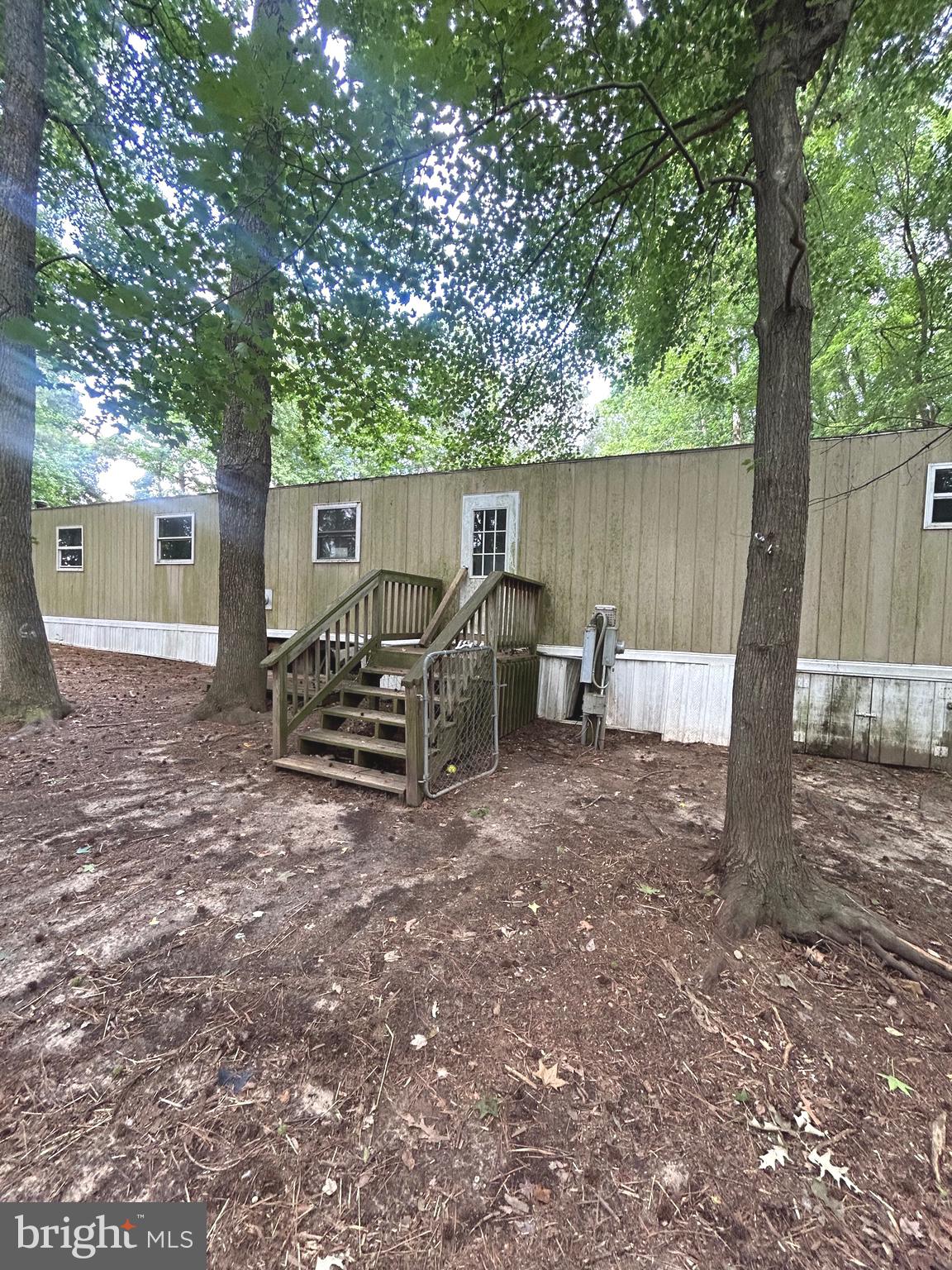 20275 Jackson Road Callaway, MD 20620 - Photo 4 of 7 a view of backyard with wooden fence and a large tree