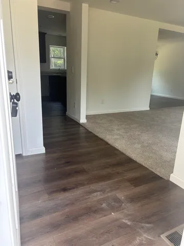 a kitchen with stainless steel appliances granite countertop a sink and a refrigerator