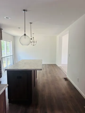 a white toilet sitting next to a bath tub