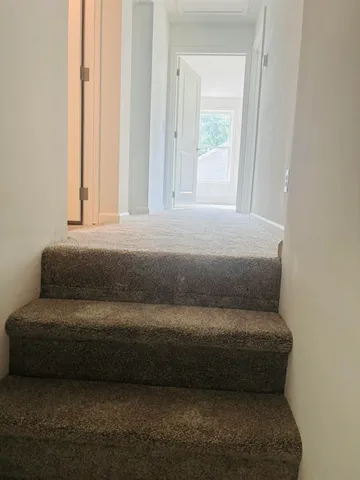 a view of room with air conditioner duct and materials on floor