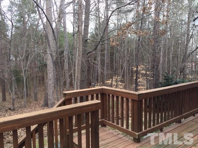 Private deck with storage looking onto the woods.