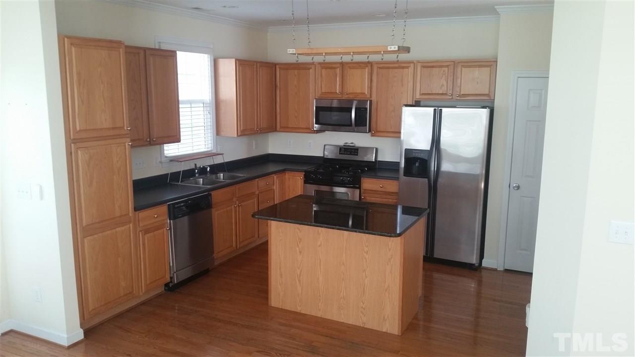 Great kitchen with hanging pot rack, granite island and lots of space. 2 pantries.