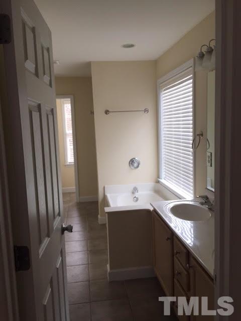 4701 Malone Court Raleigh, NC 27616 - Photo 10 of 16 Large Walk in Closet, separate garden tub and lots of space in this master bath.