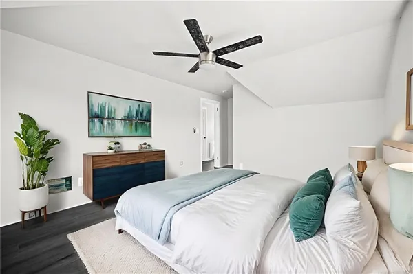 a view of a room with wooden floor