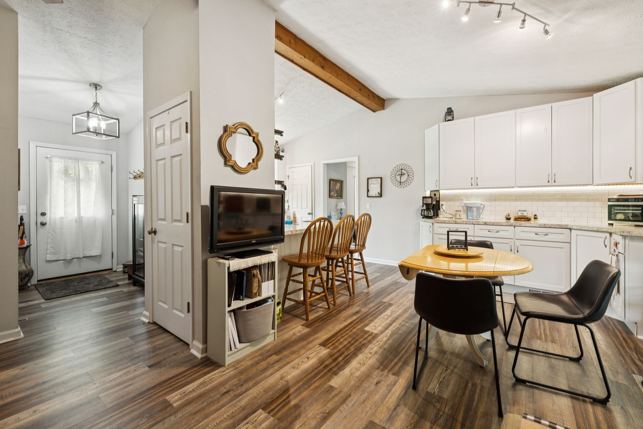 255 St Mary's Road Buffalo Valley, TN 38548 - Photo 14 of 61 a view of a dining room with furniture a fireplace and wooden floor