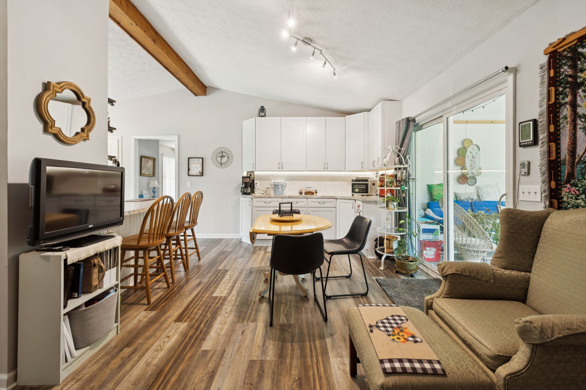 255 St Mary's Road Buffalo Valley, TN 38548 - Photo 15 of 61 a living room with furniture a flat screen tv and a floor to ceiling window