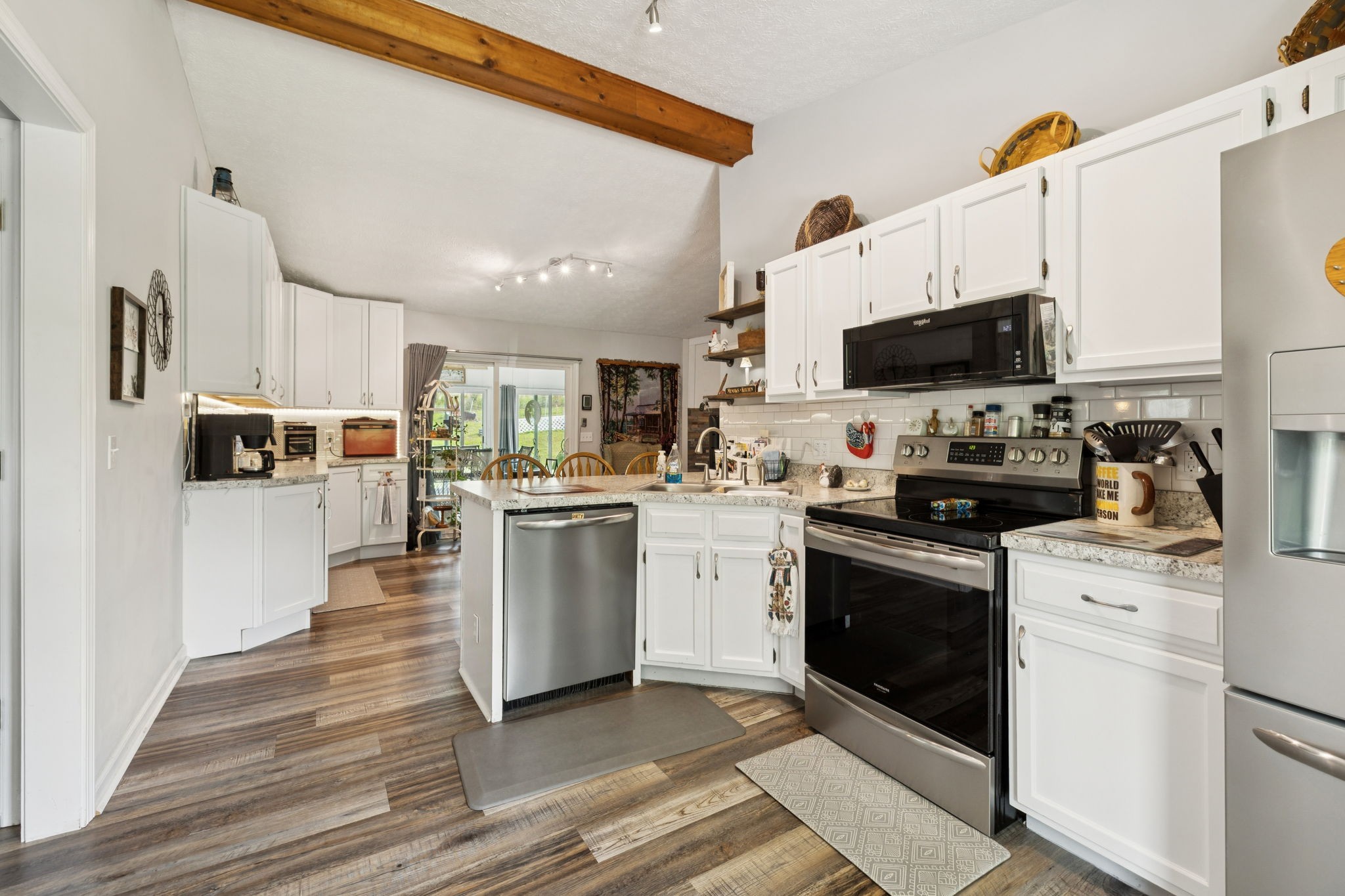 255 St Mary's Road Buffalo Valley, TN 38548 - Photo 21 of 61 a kitchen with white cabinets and appliances