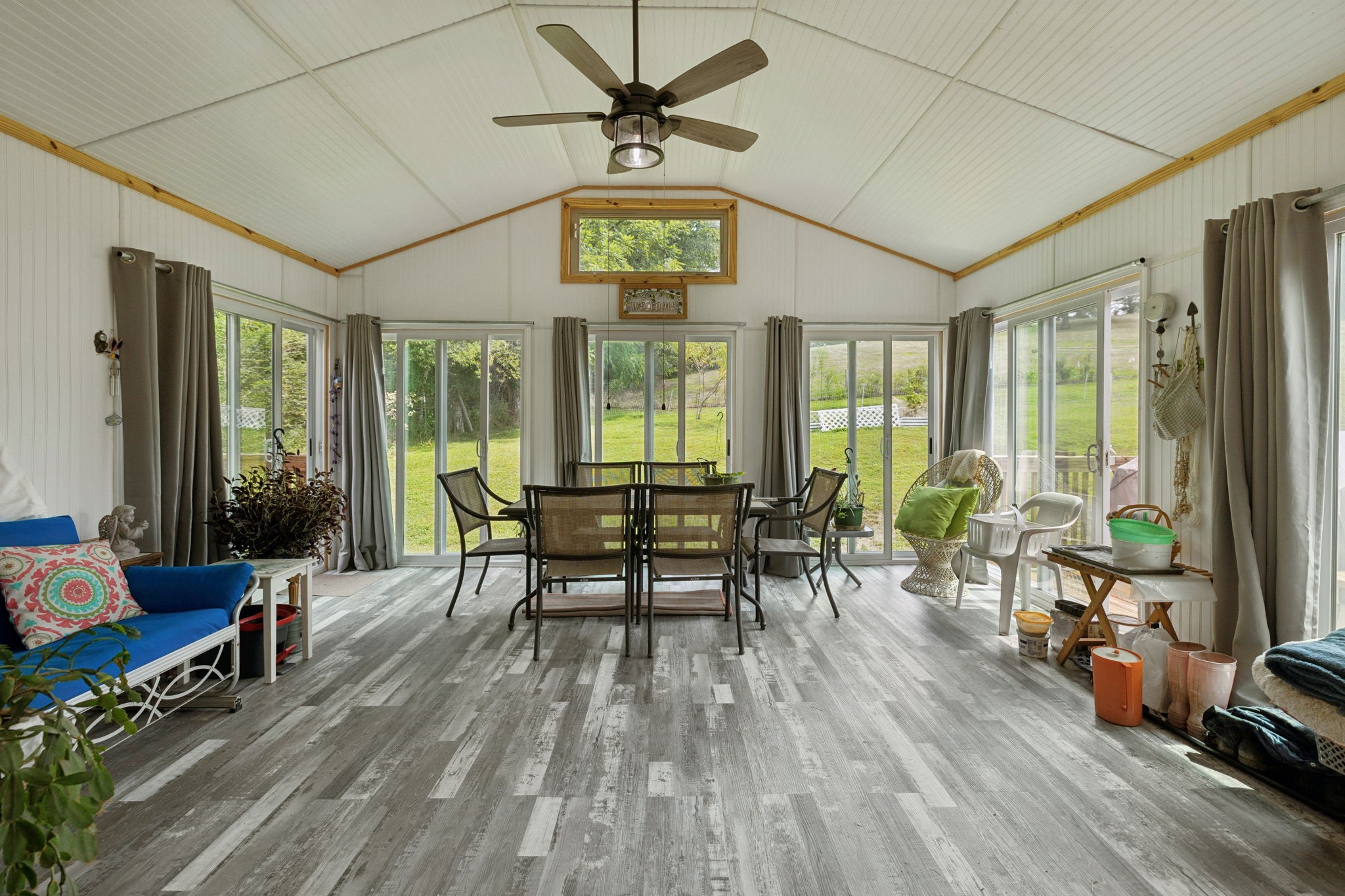 255 St Mary's Road Buffalo Valley, TN 38548 - Photo 30 of 61 a dining room with wooden floor a chandelier a glass table and chairs