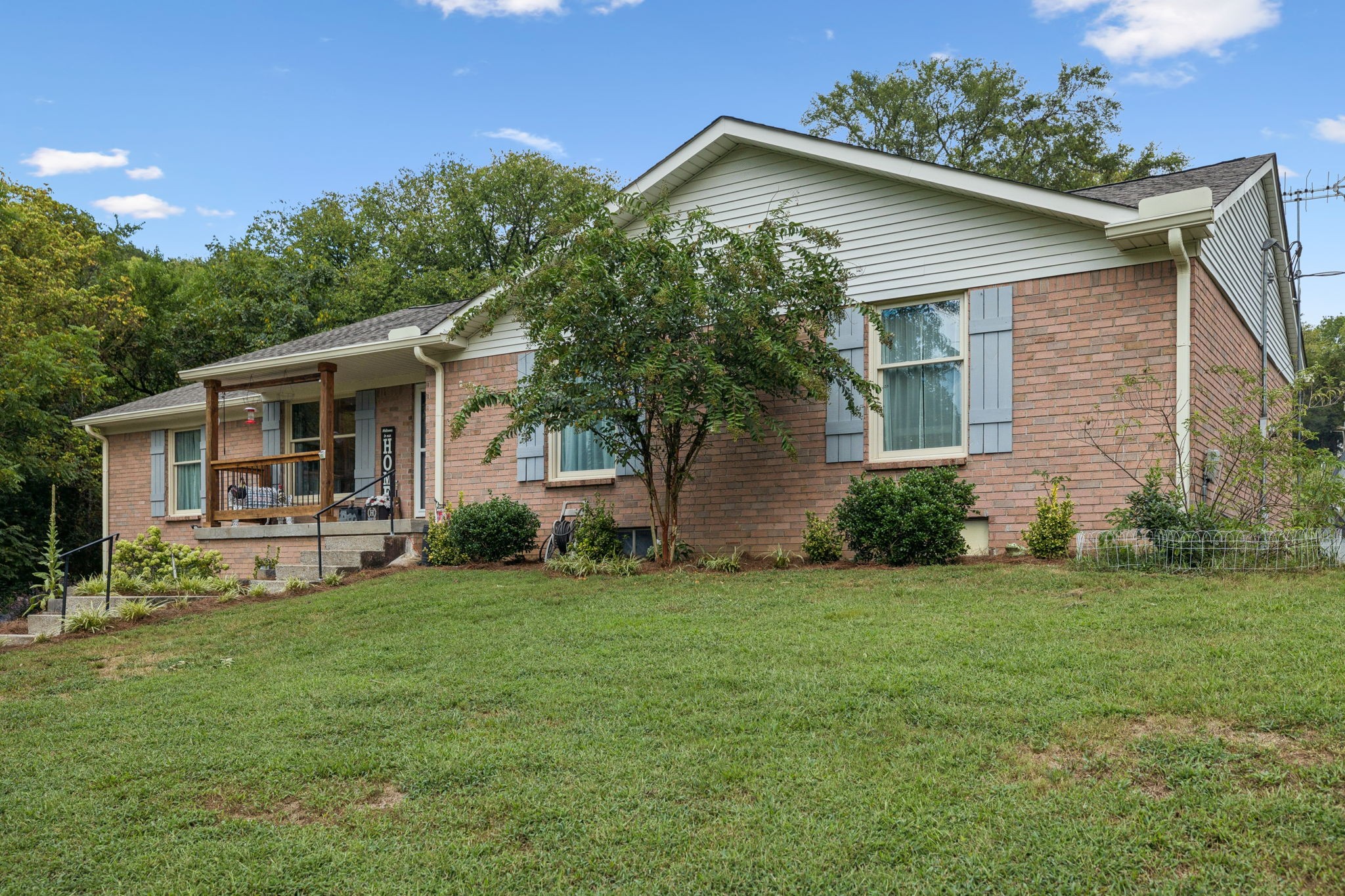 255 St Mary's Road Buffalo Valley, TN 38548 - Photo 5 of 61 a front view of a house with a garden and trees