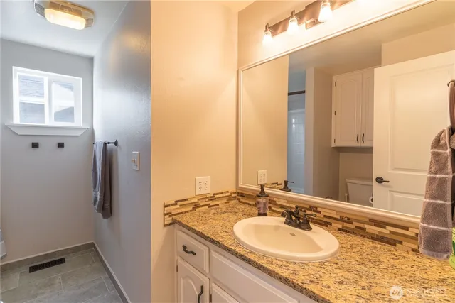 an aerial view of a house with a garden and yard