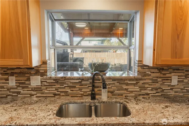 a kitchen with a sink and a window