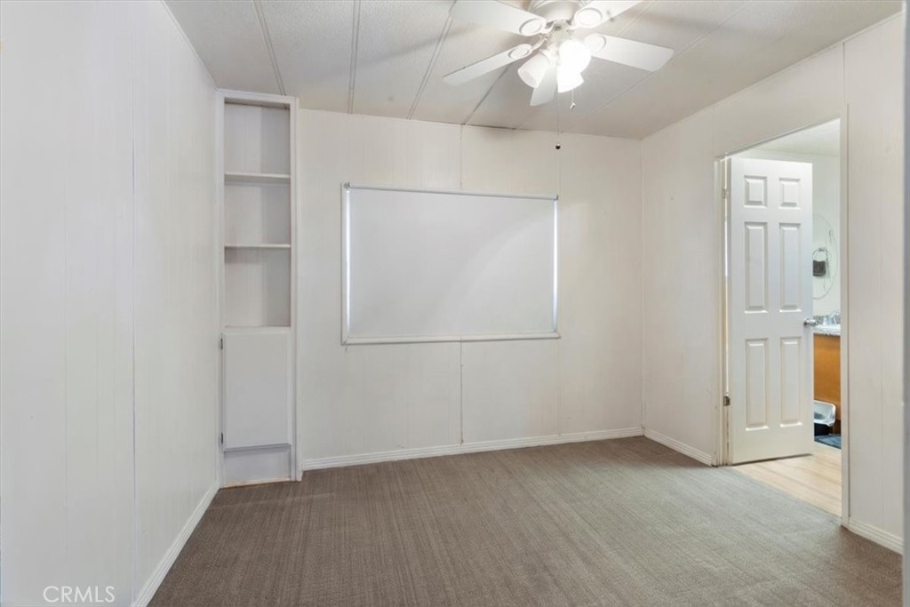 300 North Rampart Street, Unit 195 Orange, CA 92868 - Photo 20 of 25 an empty room with fan and entrance