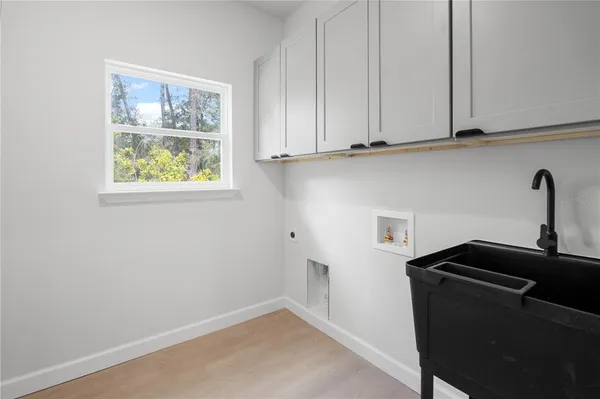 a kitchen with a sink and cabinets