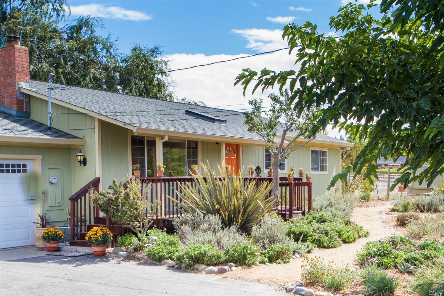 6309 Rutgers Drive Sebastopol, CA 95472 - Photo 1 of 1 a front view of a house with garden