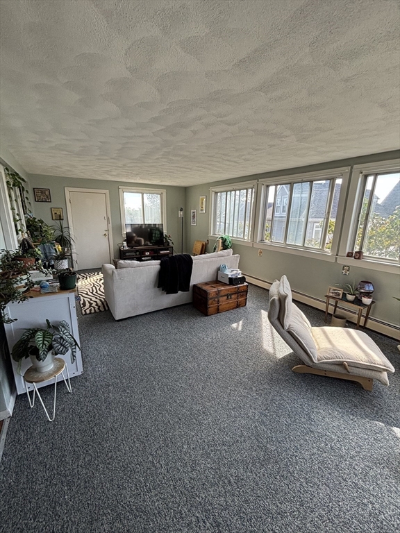 41 Harbor View Avenue Winthrop, MA 02152 - Photo 19 of 27 a living room with furniture and a large window