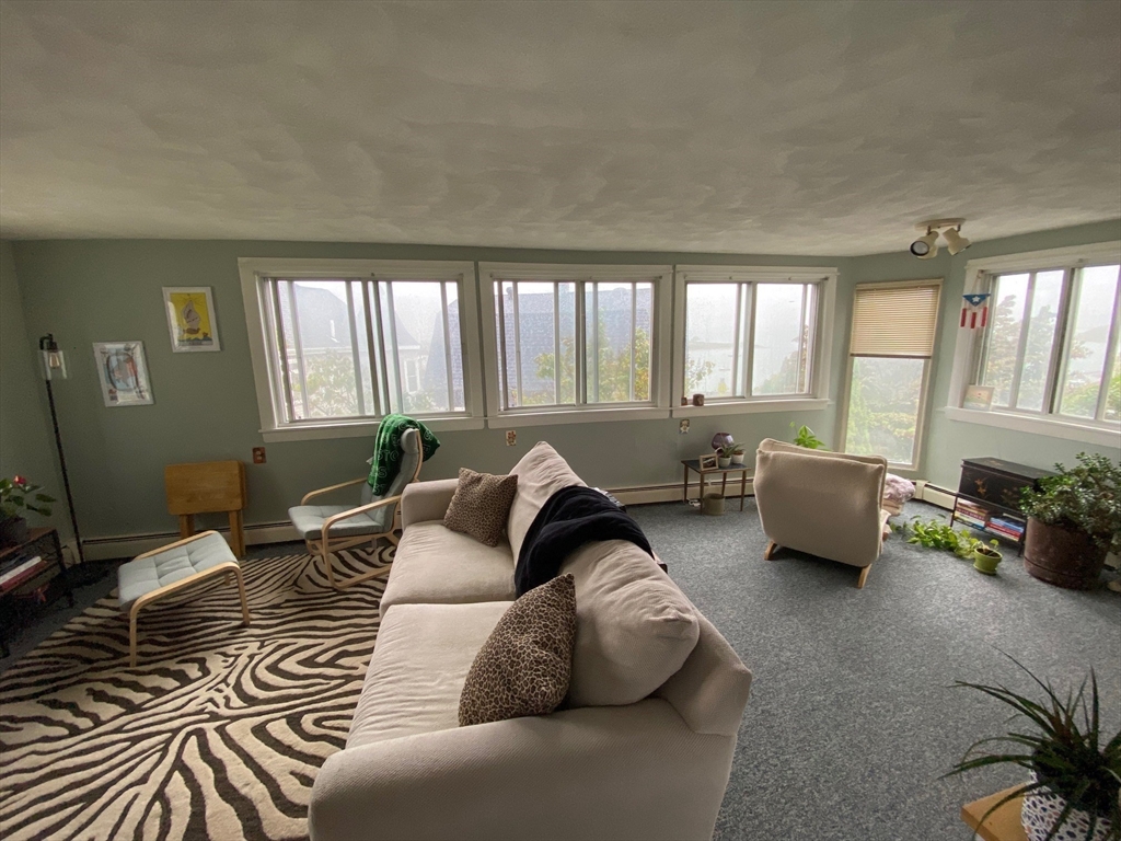 41 Harbor View Avenue Winthrop, MA 02152 - Photo 20 of 27 a living room with furniture and a large window