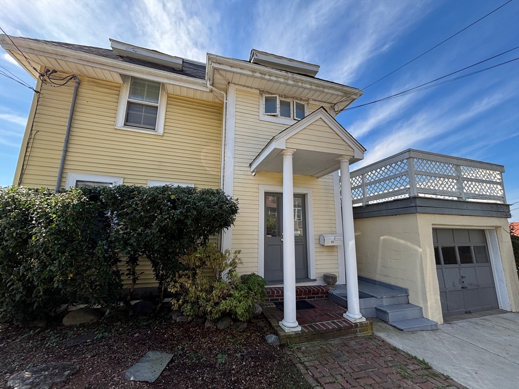 41 Harbor View Avenue Winthrop, MA 02152 - Photo 3 of 27 a front view of a house with garden
