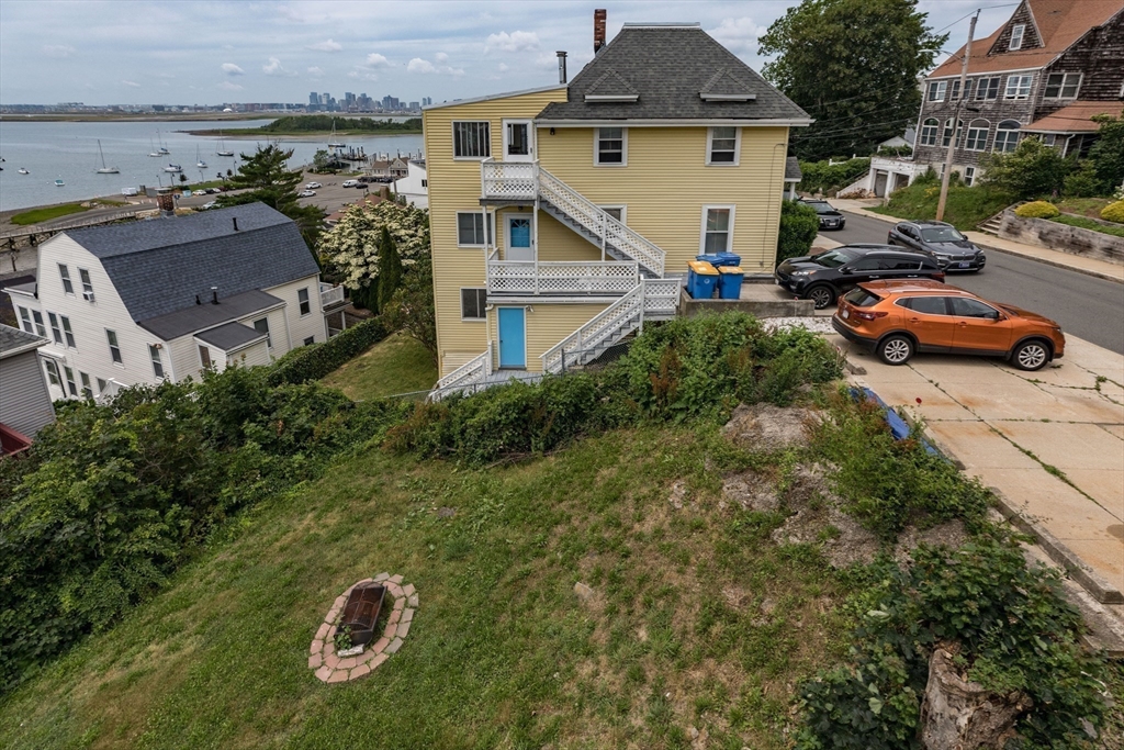 41 Harbor View Avenue Winthrop, MA 02152 - Photo 4 of 27 an aerial view of a house with swimming pool garden and mountain view