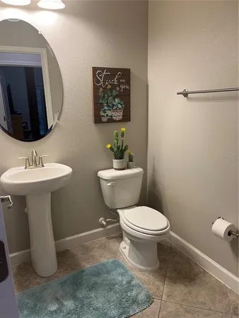 a bedroom with a bed and a mirror
