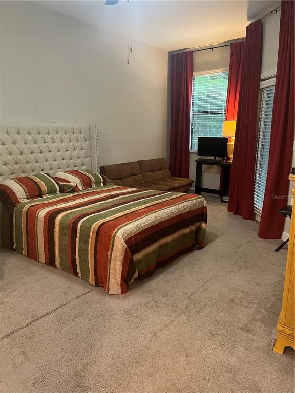 17361 Old Tobacco Road Lutz, FL 33558 - Photo 17 of 27 a spacious bedroom with a bed and a window