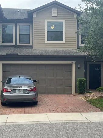 a car parked in front of a house