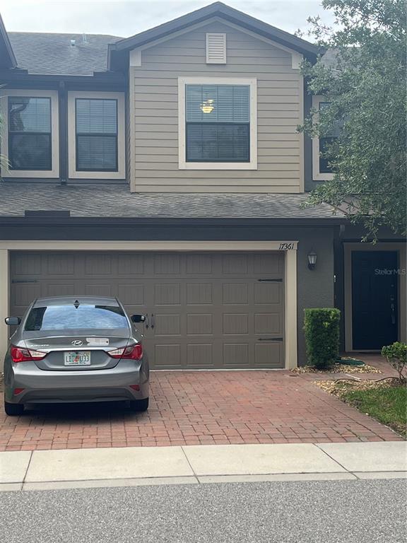 17361 Old Tobacco Road Lutz, FL 33558 - Photo 2 of 27 a car parked in front of a house