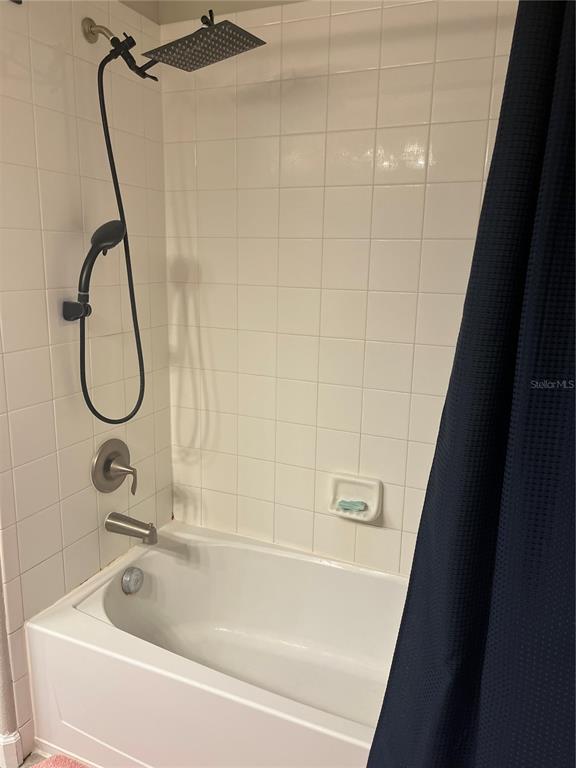 17361 Old Tobacco Road Lutz, FL 33558 - Photo 23 of 27 a bathroom with a bath tub and a shower