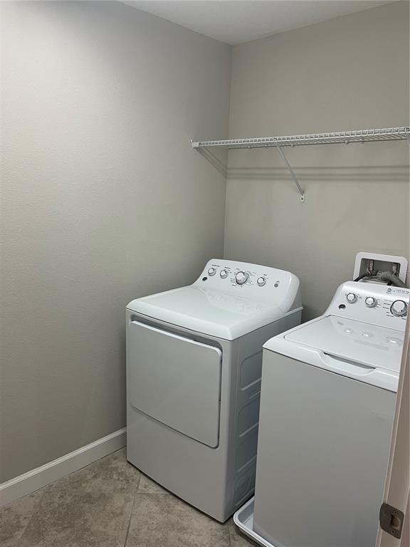 17361 Old Tobacco Road Lutz, FL 33558 - Photo 24 of 27 a utility room with dryer and washer