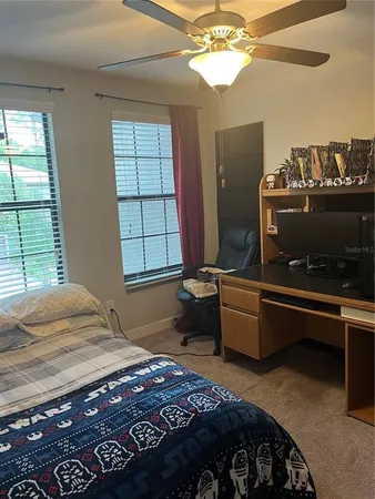 a bedroom with bed and window