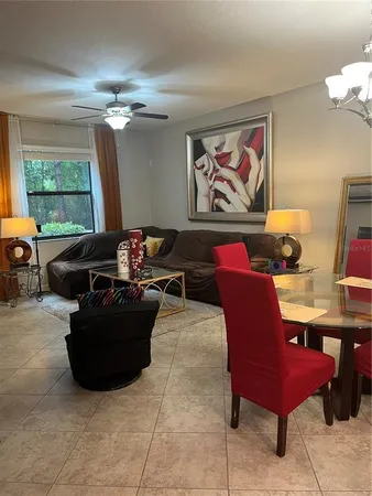 a living room with furniture and a window