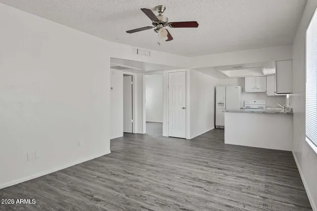 a view of a kitchen with wooden floor and a kitchen