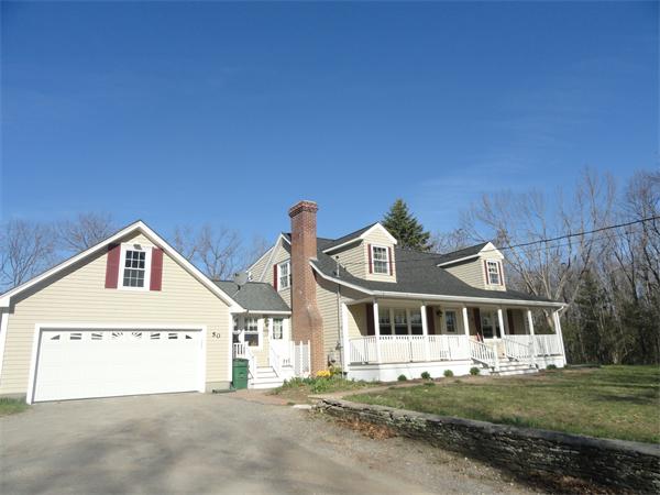 50 Paddock Road Rutland, MA 01543 - Photo 1 of 22 a front view of a house with a garden