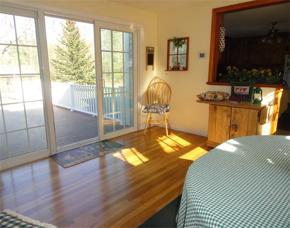 50 Paddock Road Rutland, MA 01543 - Photo 11 of 22 a bedroom with a bed and wooden floor