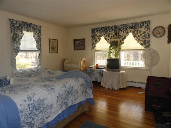50 Paddock Road Rutland, MA 01543 - Photo 15 of 22 a bedroom with a bed and a window