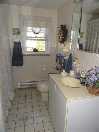 50 Paddock Road Rutland, MA 01543 - Photo 17 of 22 a bathroom with a sink toilet and window