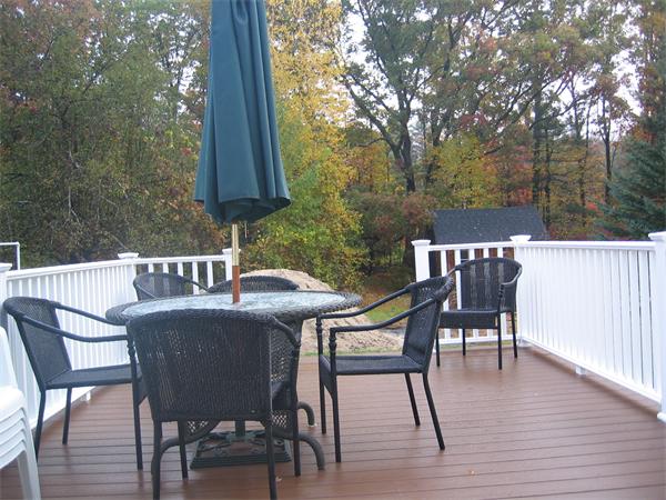 50 Paddock Road Rutland, MA 01543 - Photo 20 of 22 a view of a patio with a table and chairs
