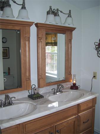 50 Paddock Road Rutland, MA 01543 - Photo 8 of 22 a bathroom with a sink and two mirror