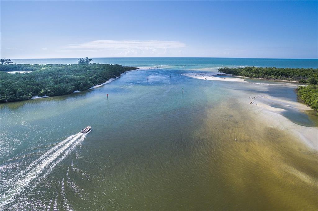 435 Dockside Drive, Unit B703 Naples, FL 34110 - Photo 35 of 38 a view of a lake with a city