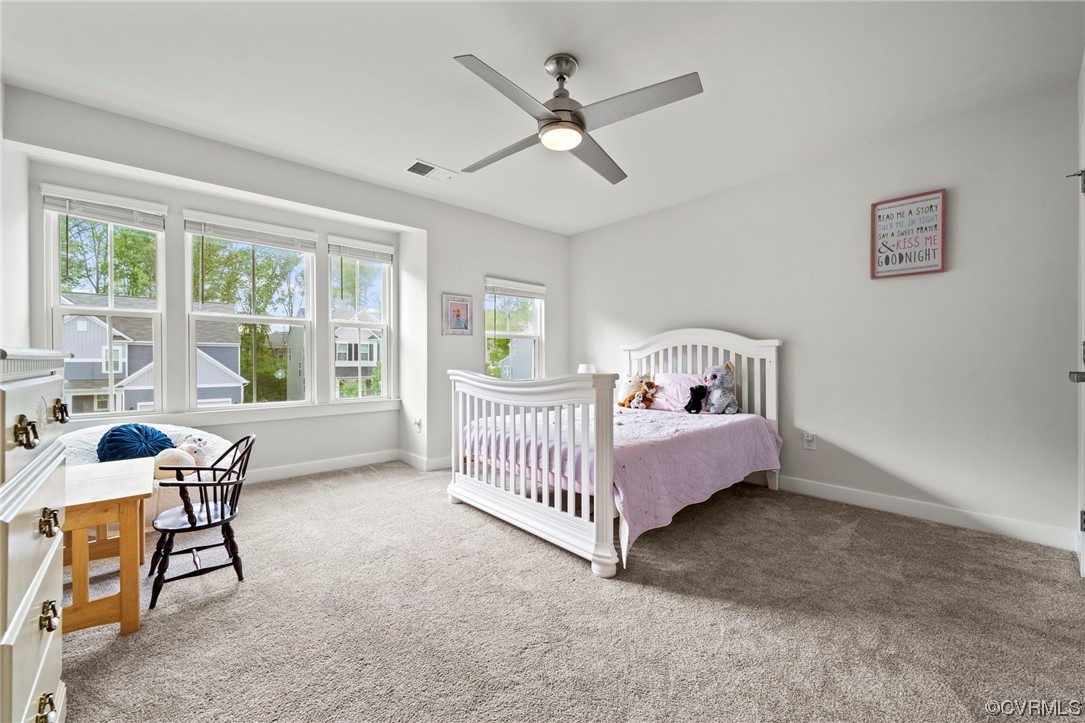 4125 Cambrian Circle Midlothian, VA 23112 - Photo 17 of 21 a bedroom with a bed and large windows