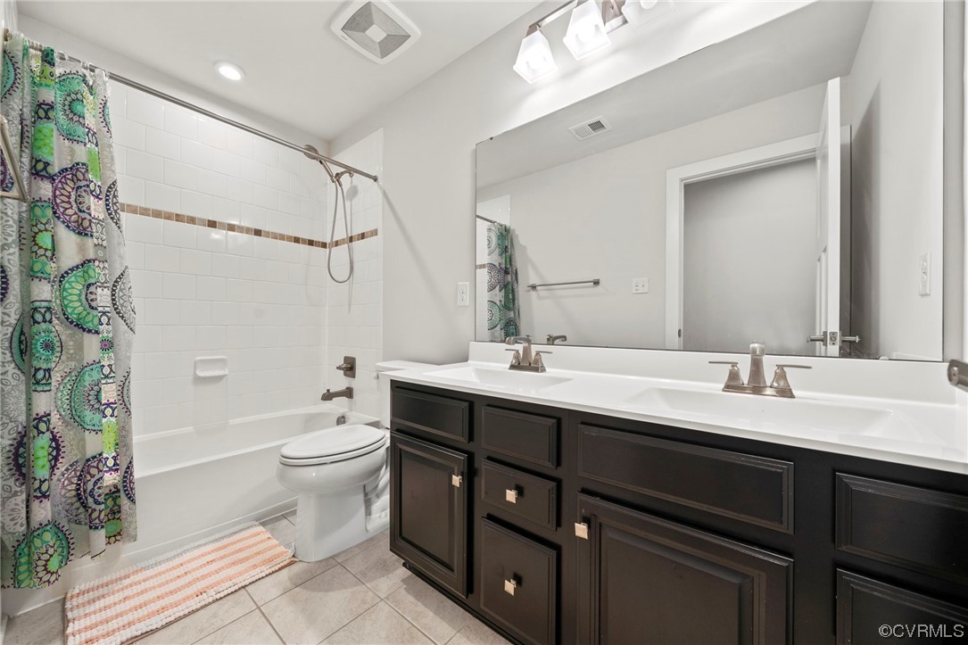 4125 Cambrian Circle Midlothian, VA 23112 - Photo 19 of 21 a bathroom with a double vanity sink toilet and shower