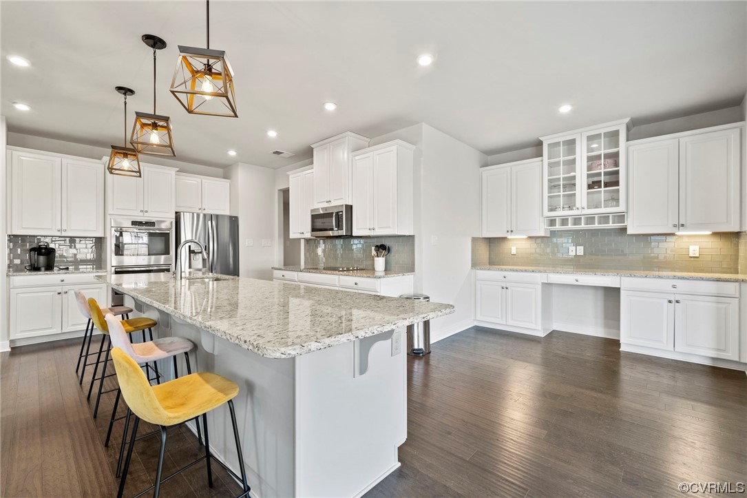 4125 Cambrian Circle Midlothian, VA 23112 - Photo 3 of 21 a kitchen with stainless steel appliances granite countertop a sink dishwasher and white cabinets with wooden floor