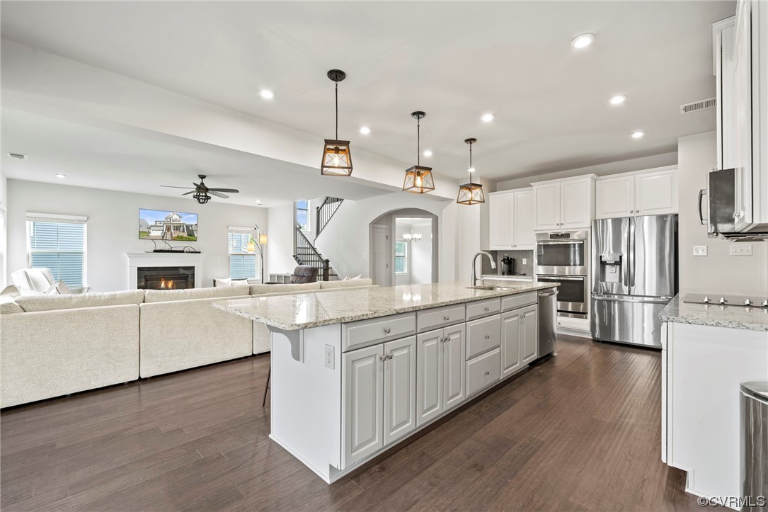 4125 Cambrian Circle Midlothian, VA 23112 - Photo 7 of 21 a large kitchen with white cabinets and stainless steel appliances