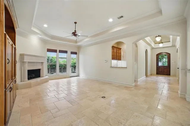 a kitchen with granite countertop stainless steel appliances a stove sink and cabinets