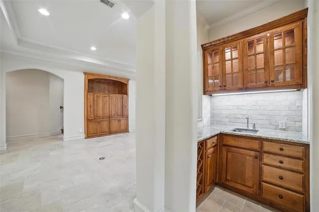 a large kitchen with a table and chairs