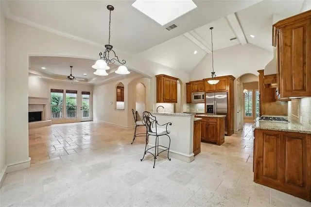 a view of a livingroom with furniture and a bathroom