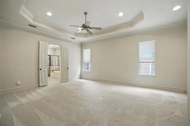 a view of empty room with ceiling fan