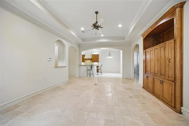 a view of a hallway with entryway wooden floor and front door