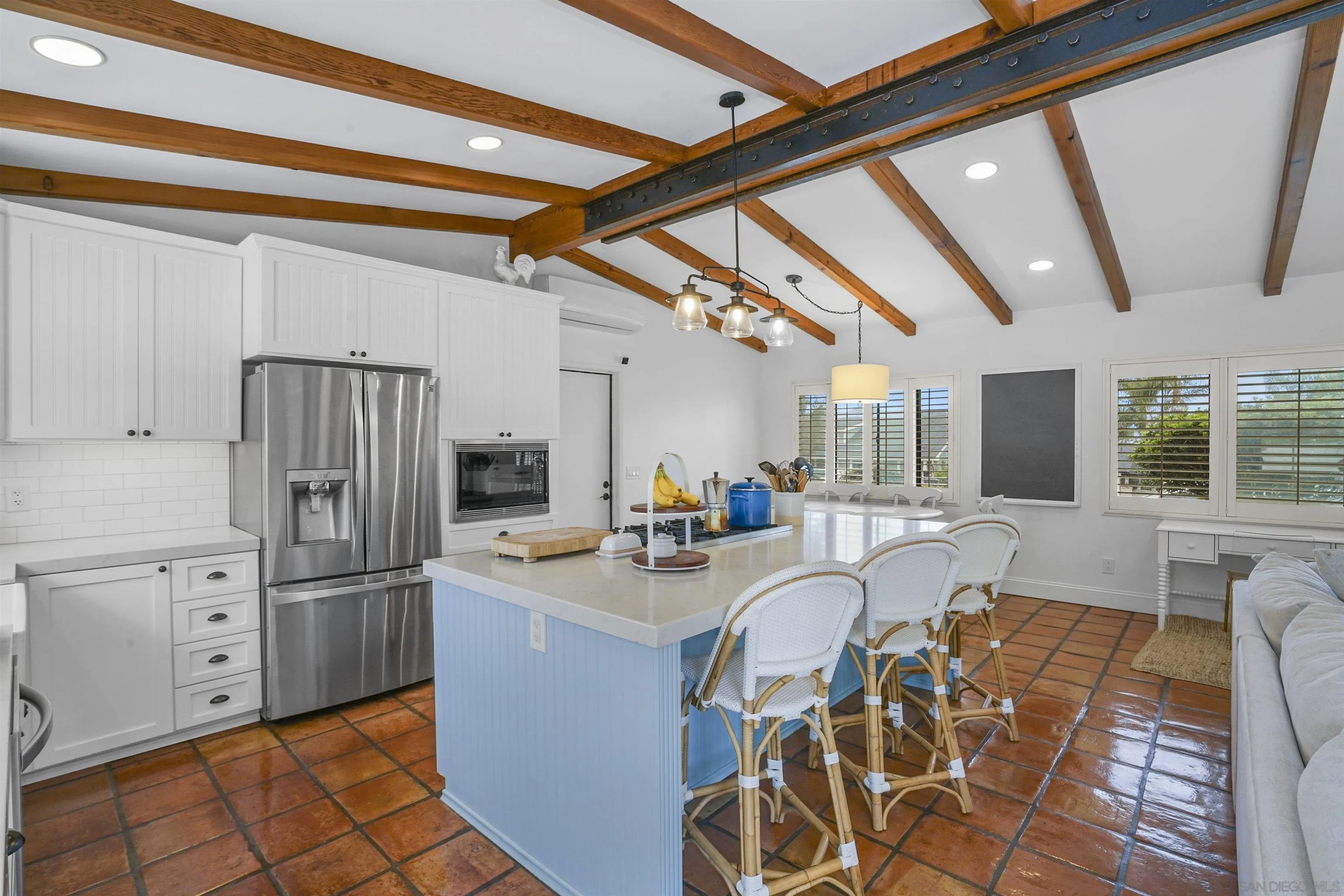 1235 Blue Sky Drive Cardiff, CA 92007 - Photo 11 of 35 a kitchen with stainless steel appliances granite countertop a refrigerator and a sink