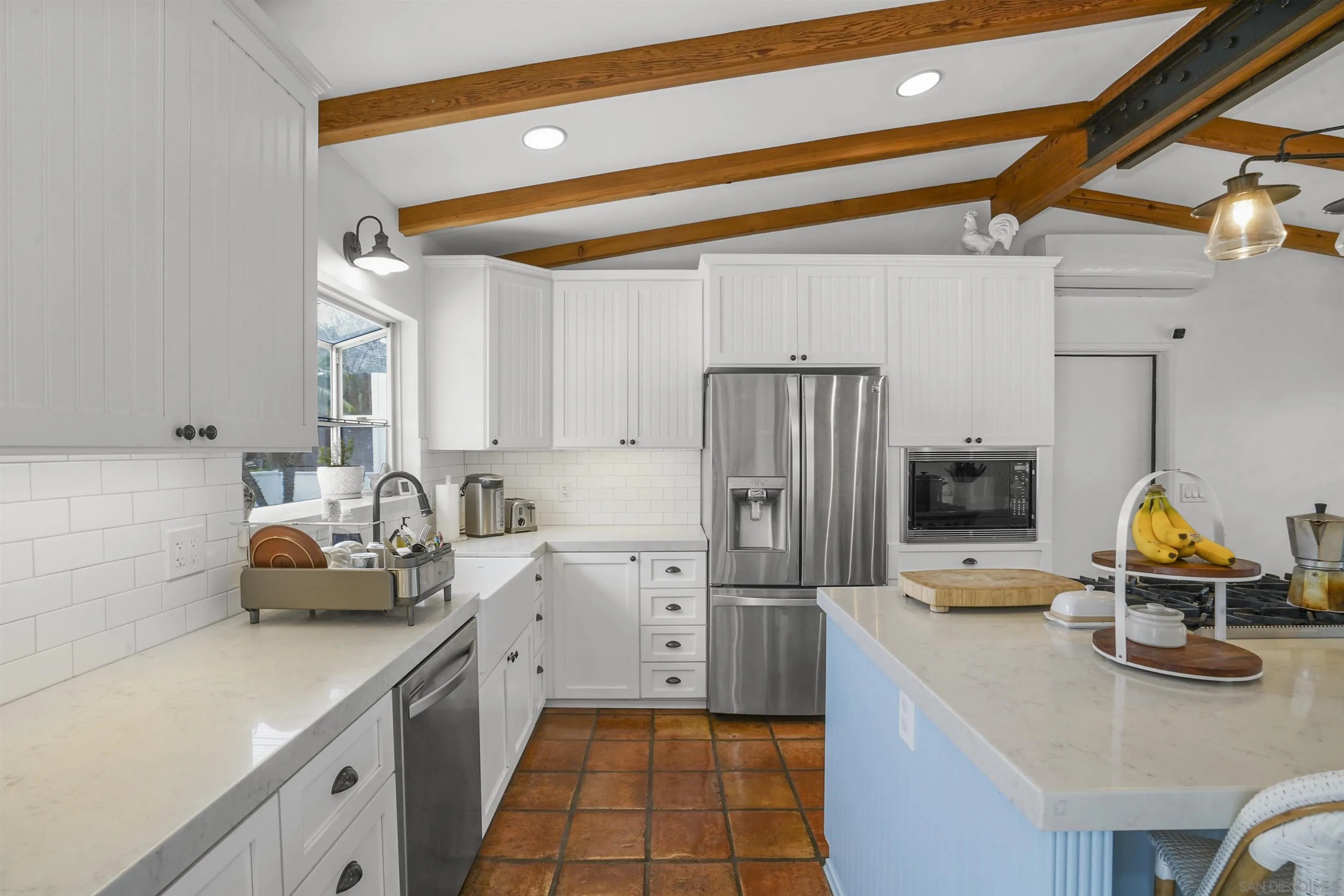 1235 Blue Sky Drive Cardiff, CA 92007 - Photo 13 of 35 a kitchen with refrigerator and cabinets